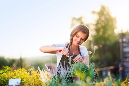 Worker handling green waste with protective equipment